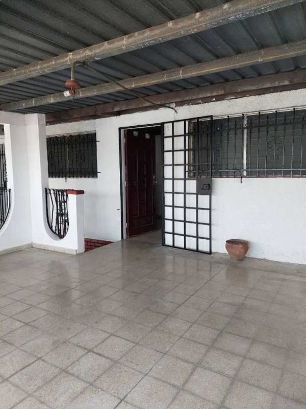 Front porch with decorative iron bars and tiled floor residential house Juan Díaz Panama