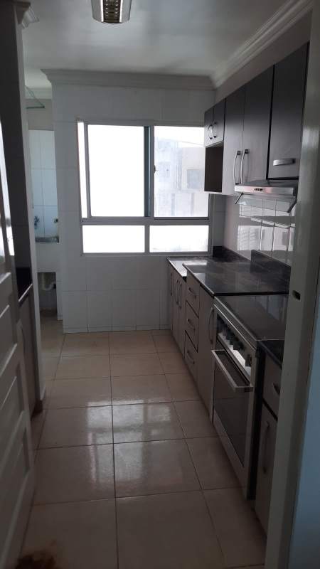 Kitchen with granite countertops built-in oven cooktop range hood and ample cabinetry PH Villa de las Fuentes Panama