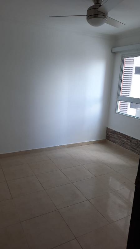 Bedroom with ceiling fan, accent wall and large window PH Villa de las Fuentes Panama
