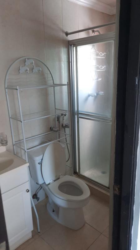 Compact bathroom with glass shower, vanity and toilet PH Villa de las Fuentes Panama