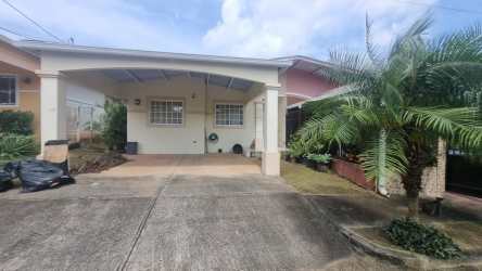 Exterior of single-story house with drive-in parking covered porch Sausalito Hills La Chorrera Panama