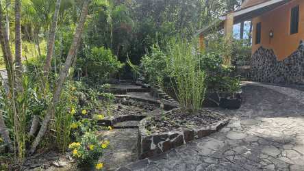 Large covered terrace with metal railings panoramic mountain views in Altos del María property