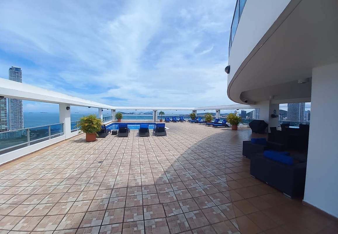 Modern unfurnished living room with wood floor open kitchen duplex staircase PH Bayfront Tower Avenida Balboa Panama