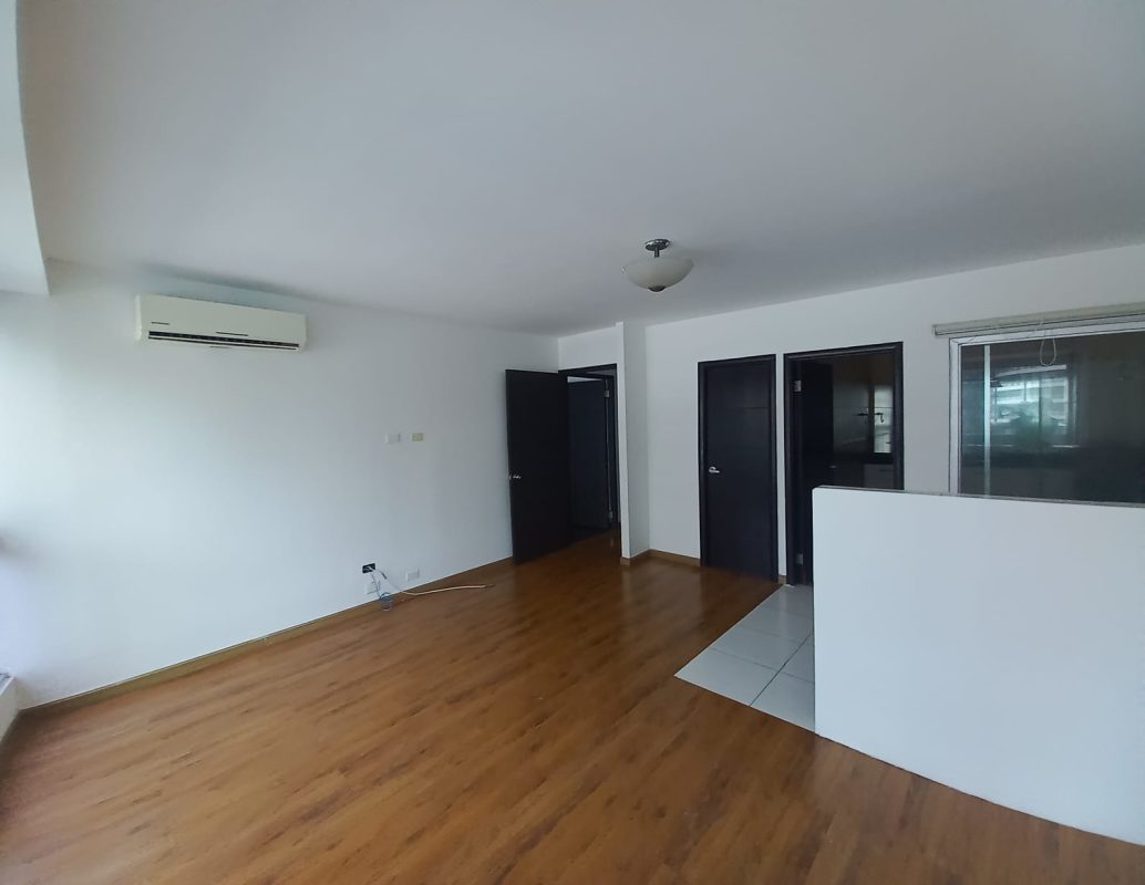 Modern glass facade of PH Bayfront Tower on Avenida Balboa Panama City waterfront