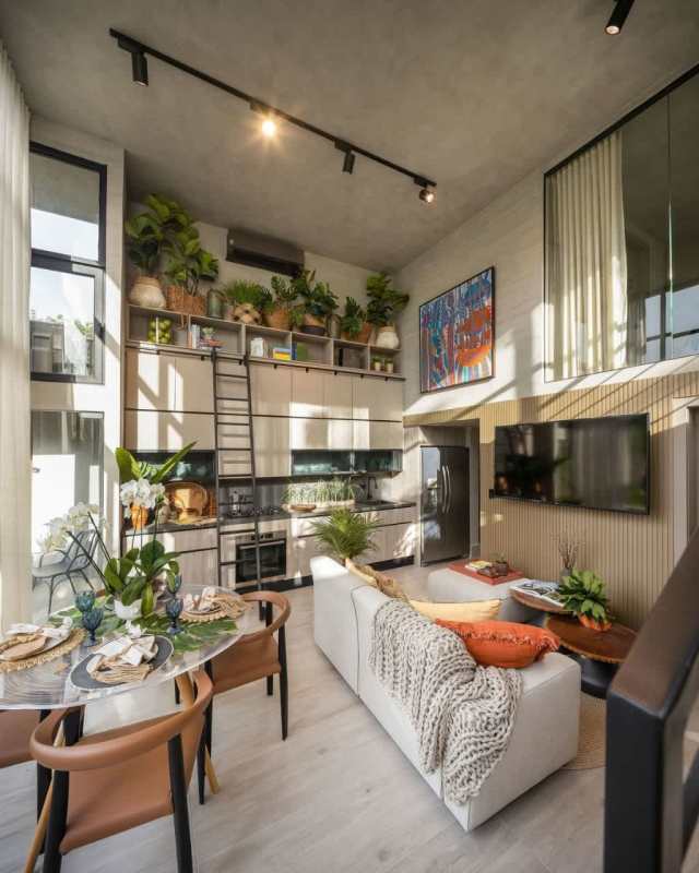 Contemporary kitchen in loft apartment with modern cabinetry and porcelain tile Panama City