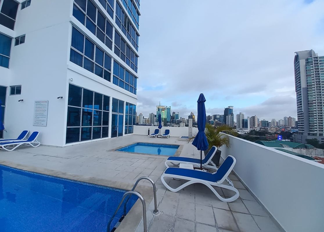 Rooftop pool terrace lounge chairs skyline views PH Marina Plaza Panama City