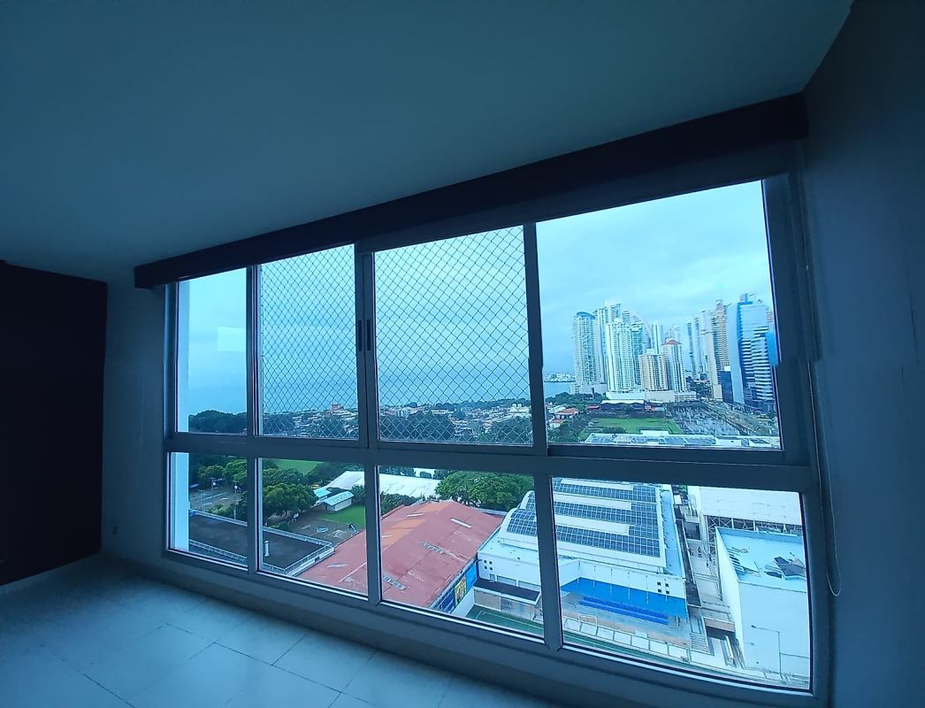 Galley kitchen with large window dark cabinetry double sink stove fridge PH Marina Plaza Panama