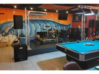 Entertainment stage drum set mural wall Sandbar Gastropub Coronado Panama commercial for sale