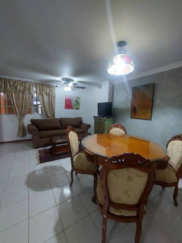 Comfortable traditional living dining combo with sofas, dining table, ceiling fan at Albrook Tower Residence Panama