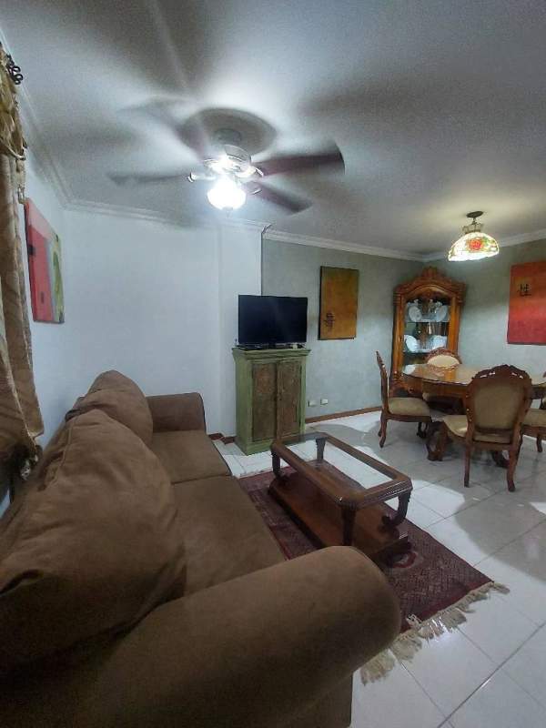 Cozy furnished living and dining space with ceiling fan and natural light in Albrook Tower Residence Clayton Panama