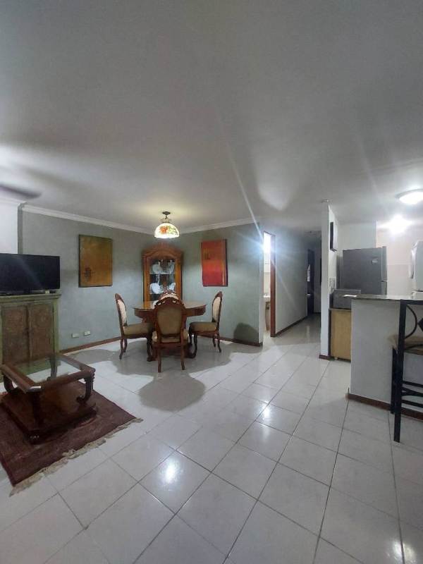 Modern kitchen with breakfast bar, appliances, overhead cabinets at Albrook Tower Residence Clayton Panama City