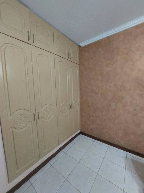 Dining area with breakfast bar, bar stools, open concept kitchen at Albrook Tower Residence Clayton Panama