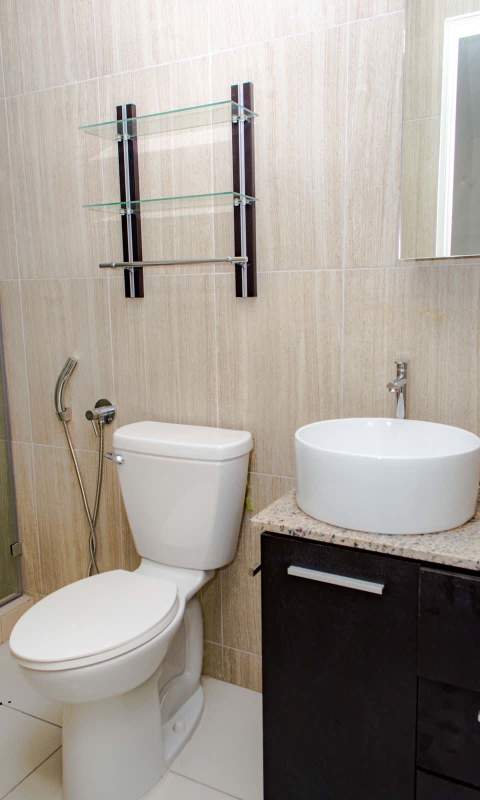 Bathroom with walk-in glass-enclosed shower and modern fixtures in PH Bellavista Tower Panama City