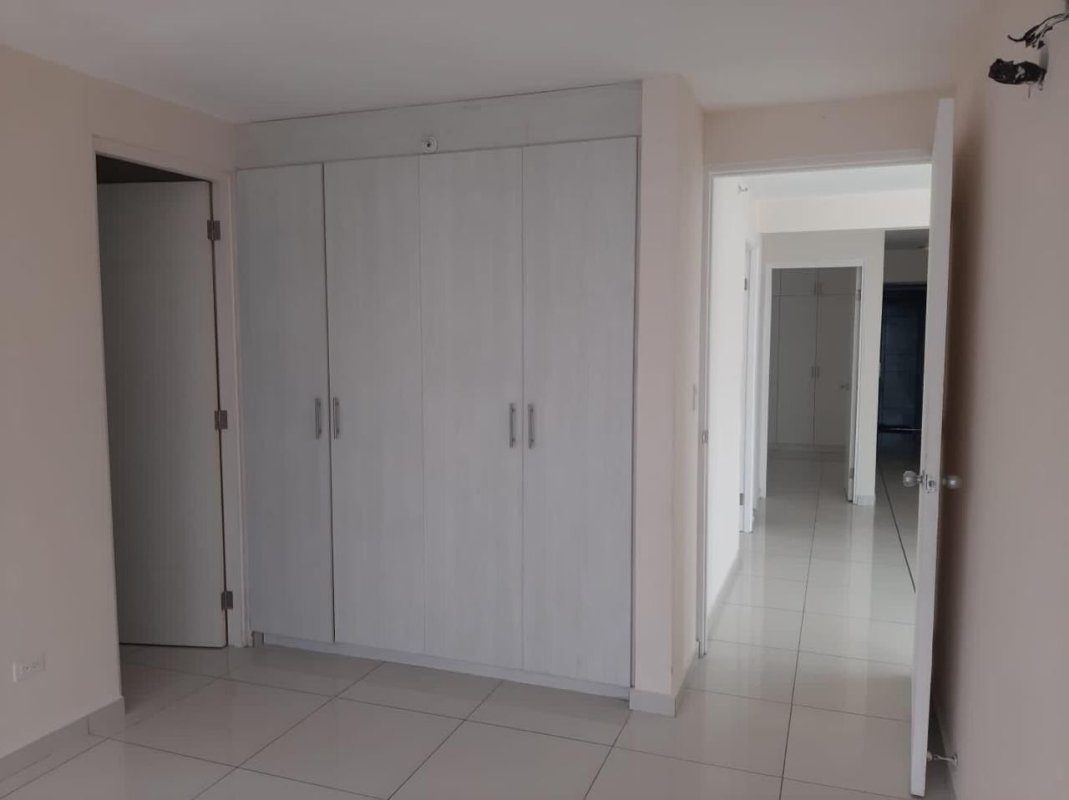 Bedroom featuring large window city view, built-in closet and ceramic floors in PH Bellavista Tower