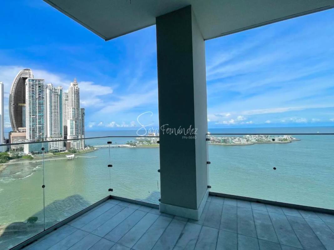 Contemporary kitchen with marble details, island, and ample cabinetry at PH Pacific Point
