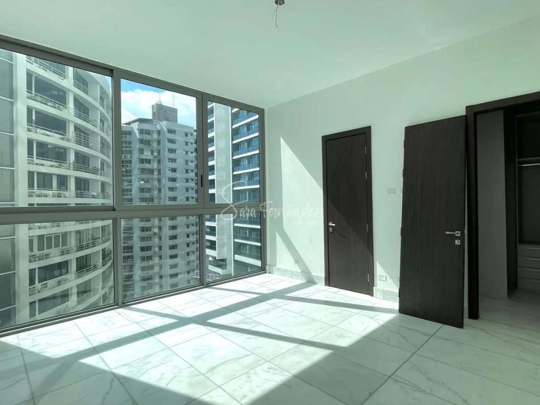 Luxury master bedroom with panoramic views, walk-in closet and marble floors at PH Pacific Point