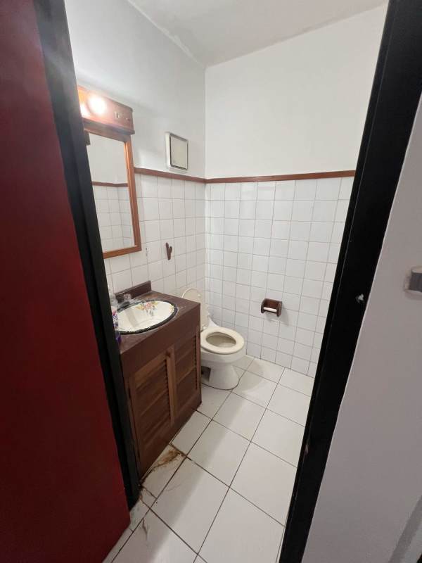 Bathroom with traditional tile, vanity sink and shower in house Obarrio Panama