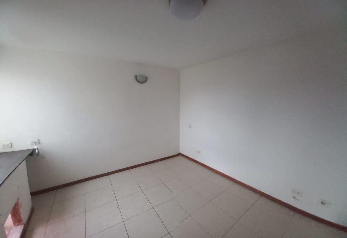 Living dining space with sliding glass door and tile flooring PH Pacific Wind