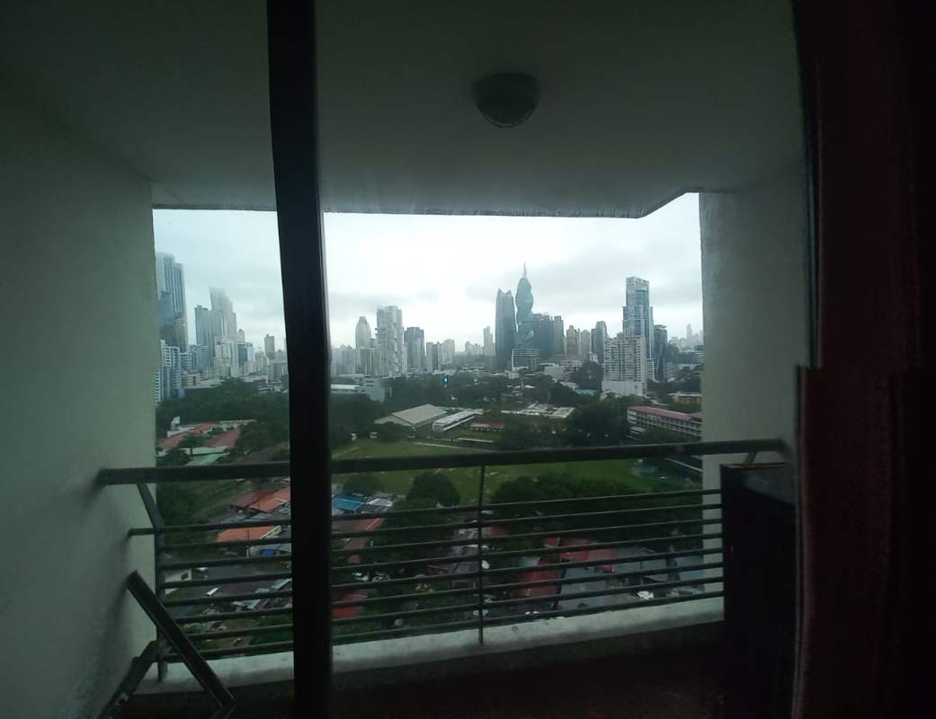 Bright living and dining space with large sliding glass door to balcony PH Pacific Wind Punta Pacifica