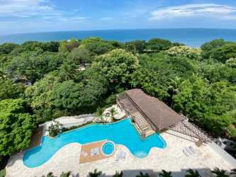 Open concept kitchen with granite counters and appliances in Punta Barco Beach Panama