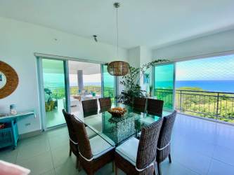 Dining area with ocean view windows and balcony access in Punta Barco Panama