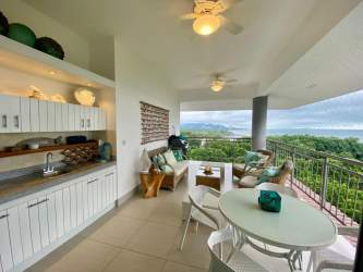 Spacious balcony with built-in BBQ and bar overlooking Pacific Ocean in Punta Barco Panama