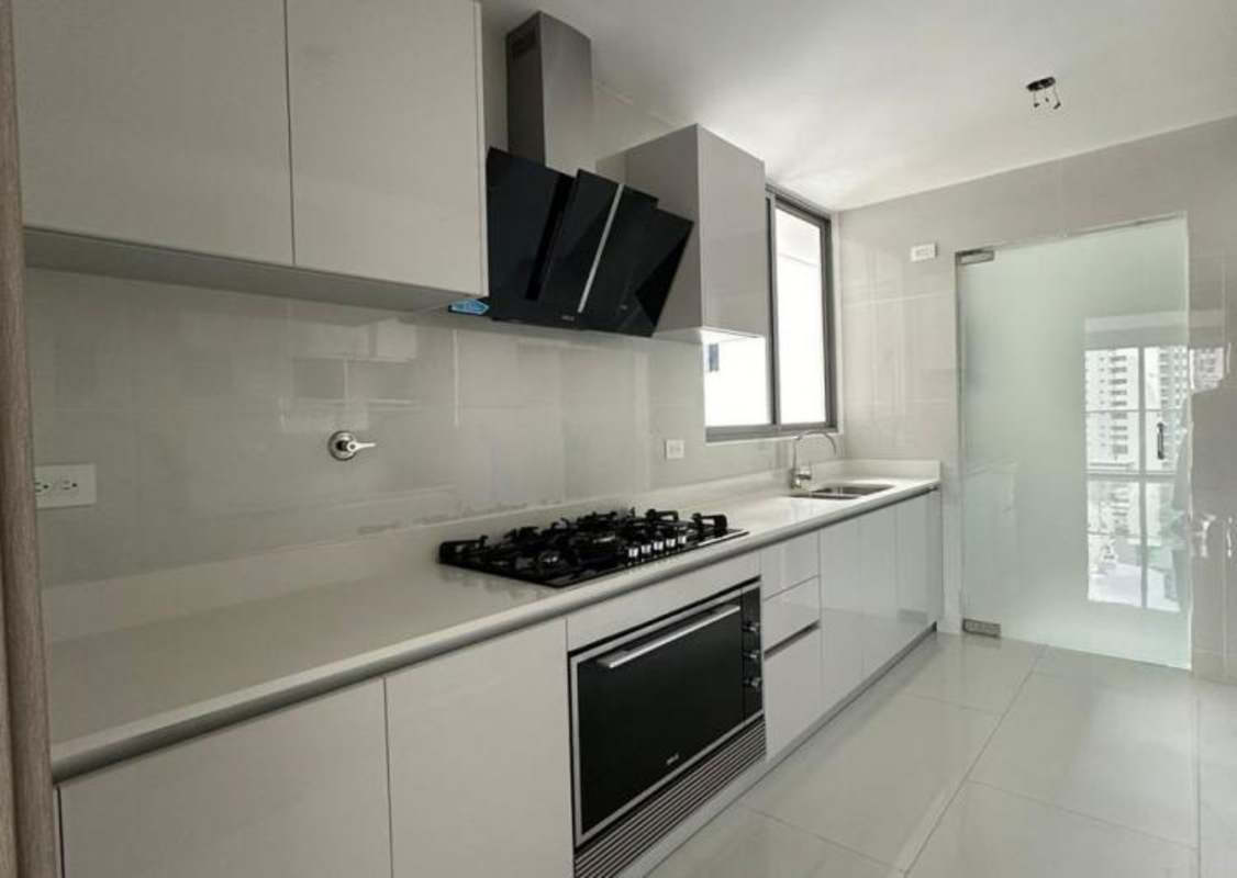 Kitchen with built-in appliances, window, and modern cabinetry PH Velure Panama