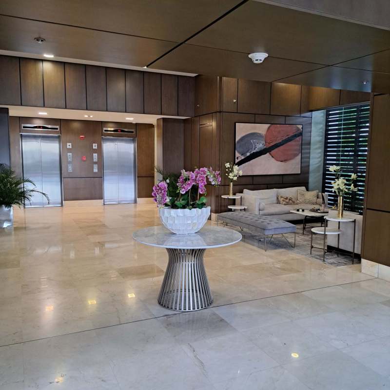 Luxury condo lobby marble floors sofa lounge PH The Privilege The Reserve Santa Maria Panama