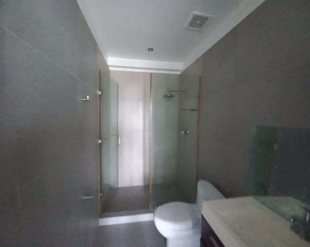 Double sink vanity and large mirror in modern bathroom at PH Yacht Club Tower Panama City