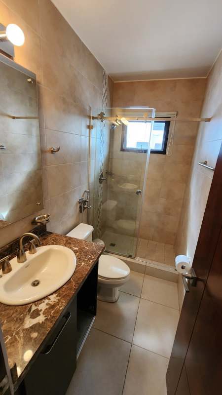 Bathroom with double vanity glass shower Embassy Club Panama