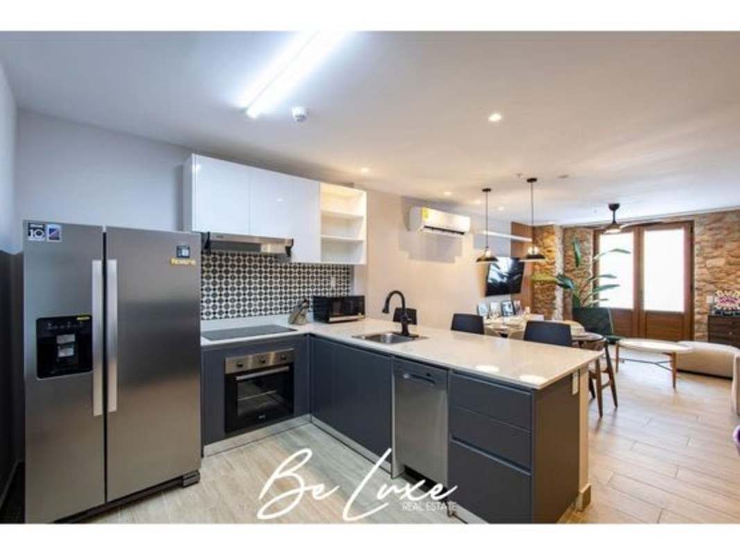 Furnished bedroom with French doors, blue wall accent PH La Cuadra Casco Antiguo Panama