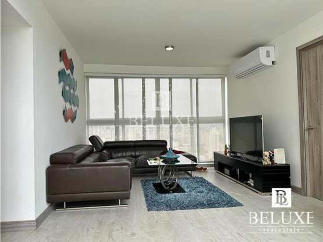 Spacious modern kitchen with granite counters, tile backsplash, natural light in PH Moon Tower duplex penthouse Panama