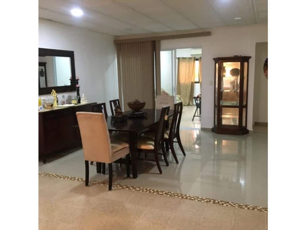 Dining area with large mirror, glass sliding door in furnished house for rent El Bosque Panama