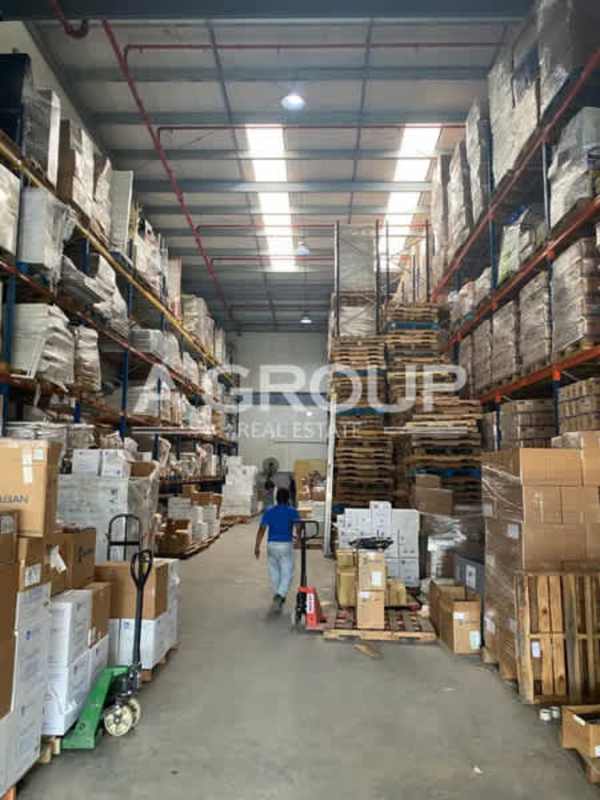 Expansive warehouse interior with shelving, pallets, and high ceiling Panama