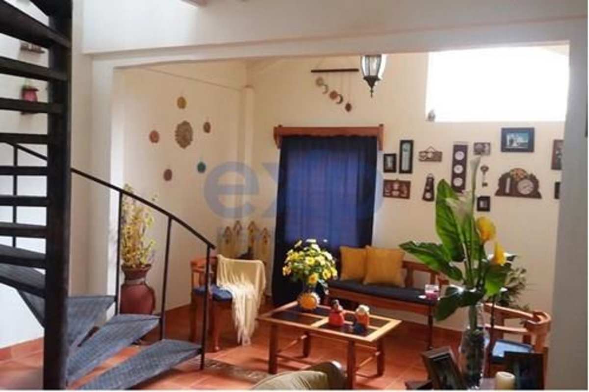 Warm rustic living area with wooden beams, tile floors, cozy decor Cerro Azul Panama property