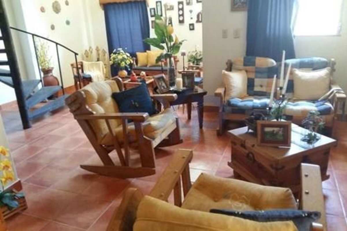 Large rustic living room with spiral stairs tile floor for sale Cerro Azul Panama