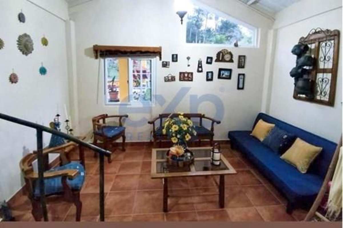 Rustic living area with wood furniture, tile floors country house in Cerro Azul Panama