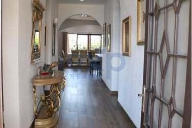 Large private pool with terracotta patio and gazebo surrounded by lush landscaping in Nueva Gorgona Panama