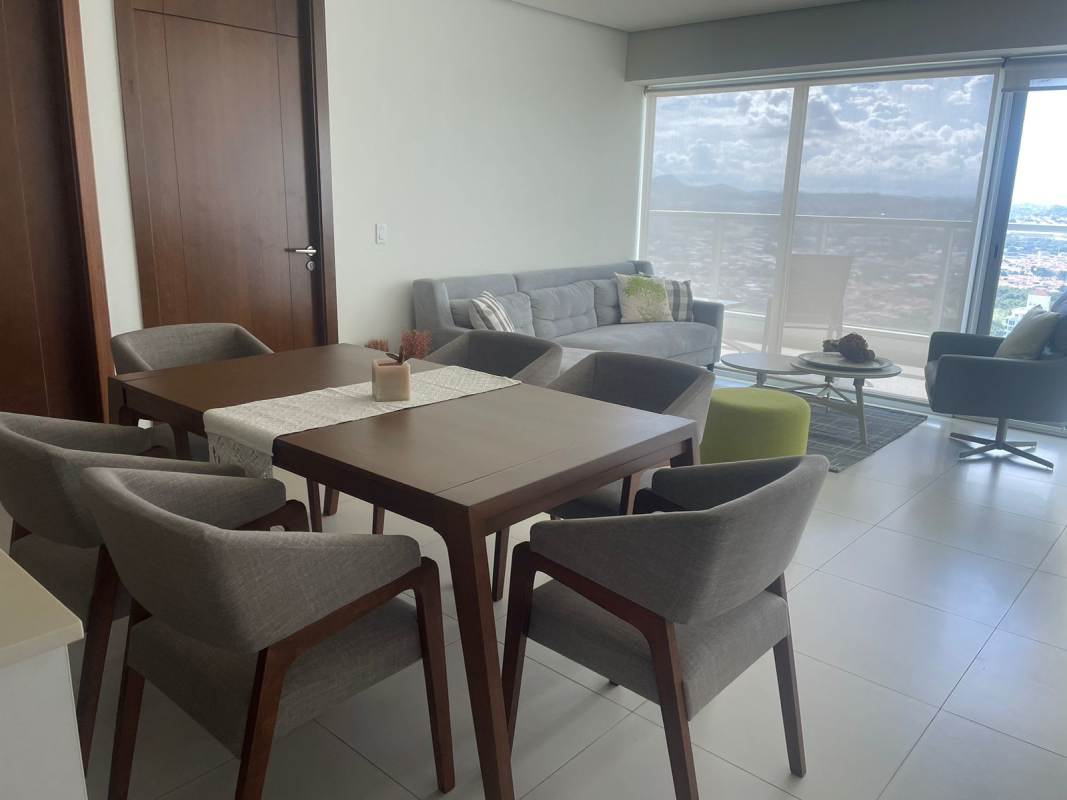 Rooftop infinity pool and jacuzzi with city skyline and ocean view at Parkside Costa del Este Panama