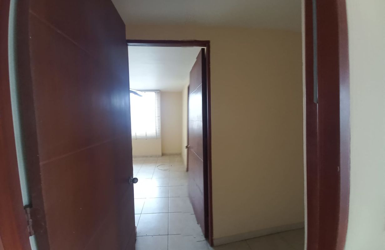 Bedroom with ceiling fan, AC, large window and city view in Costa Pacifica Punta Pacifica Panama