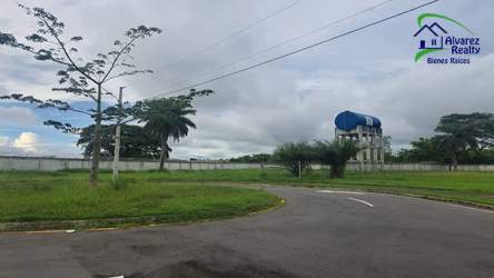 Side exterior with green lawn and driveway at new mountain home in Volcán David Panama