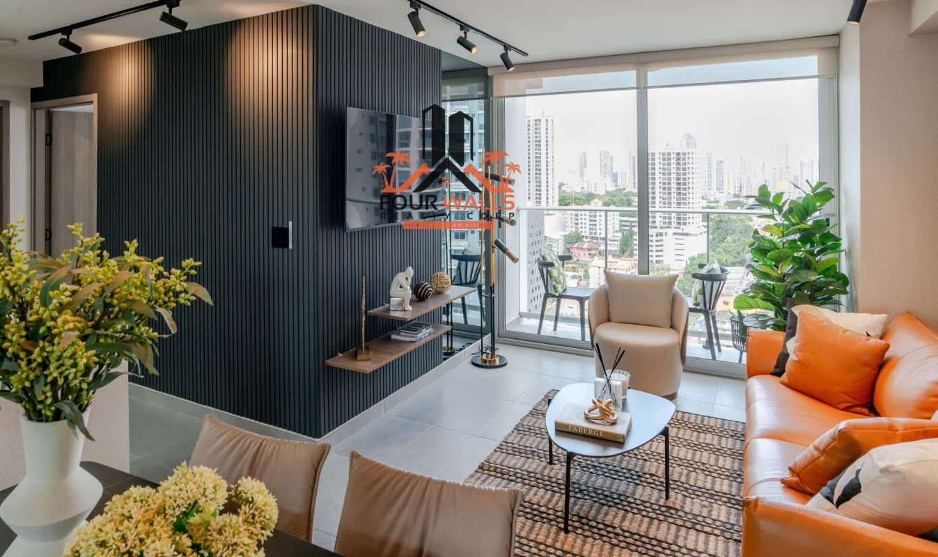 Modern living room area with floor-to-ceiling windows, city skyline in PH The Rise Park Square Bella Vista