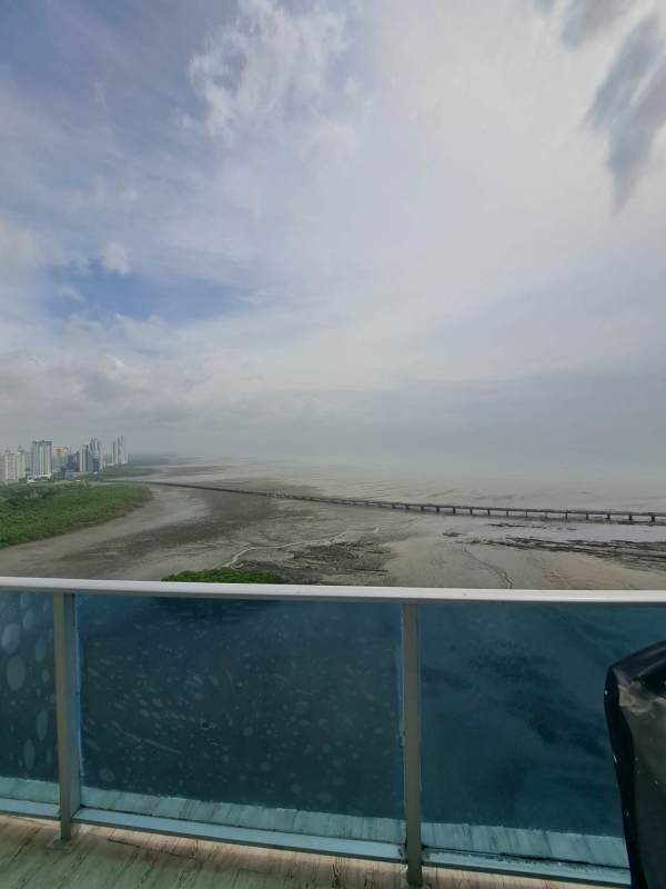 Bright duplex living room with large windows, city view, and elegant finishes at PH Coco del Mar Tower Panama