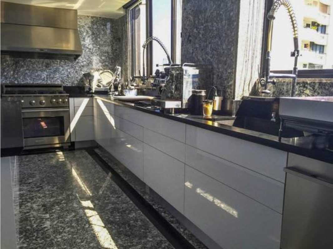 Modern bathroom with double sinks, glass shower apartment Torre La Cresta