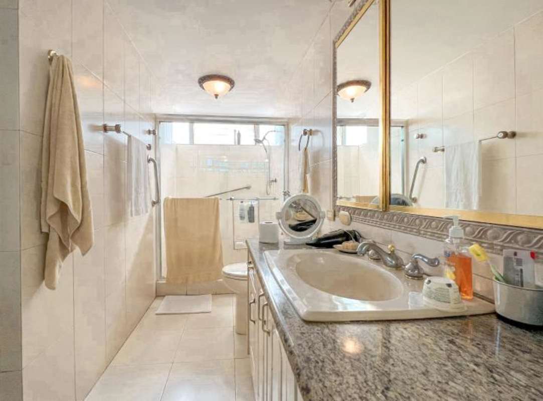 Bathroom granite vanity walk-in shower large mirror Obarrio apartment for sale