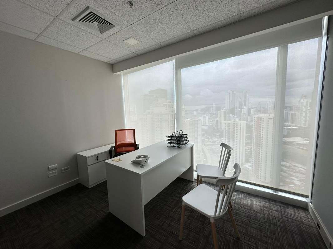 Small office with carpet, glass wall partition, ceiling lights in Torre Oceanía Panama