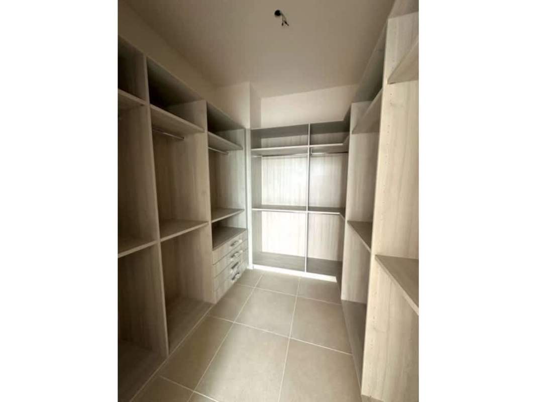 Spacious walk-in closet with custom built-in shelving in PH Ocean House Panama