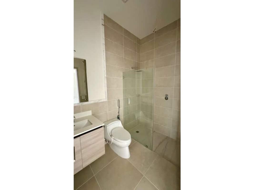 Bedroom with balcony access and ample wardrobe at PH Ocean House Santa Maria Panama