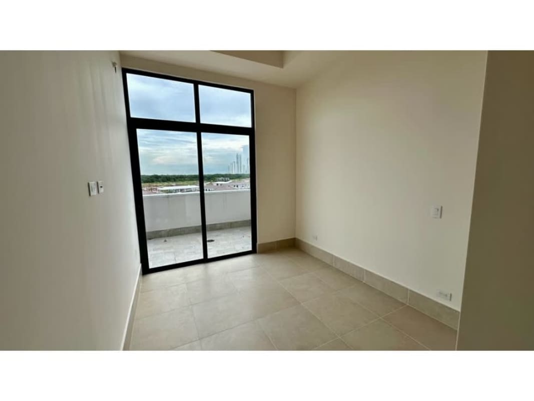 Bright bedroom with floor-to-ceiling windows and balcony in PH Ocean House Santa Maria Panama