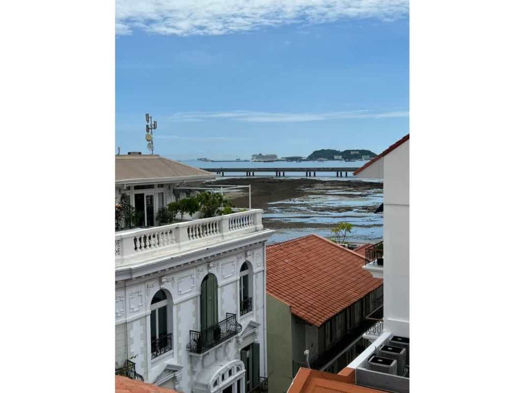 Balcony view with terracotta tiles overlooking historic Casco and ocean Panama